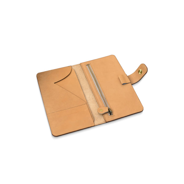 Tan leather wallet with zipper on a white background