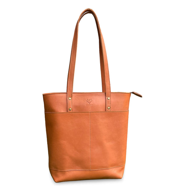 Brown leather tote bag on a white background
