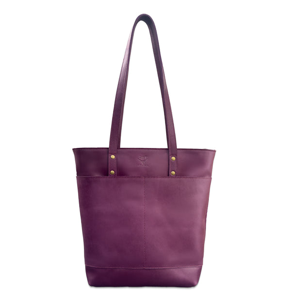 Purple tote bag with gold hardware on a white background