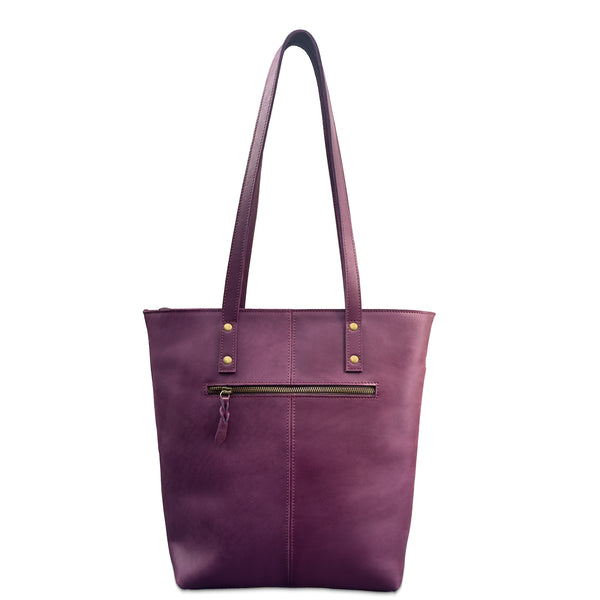 Purple tote bag with gold zipper on a white background
