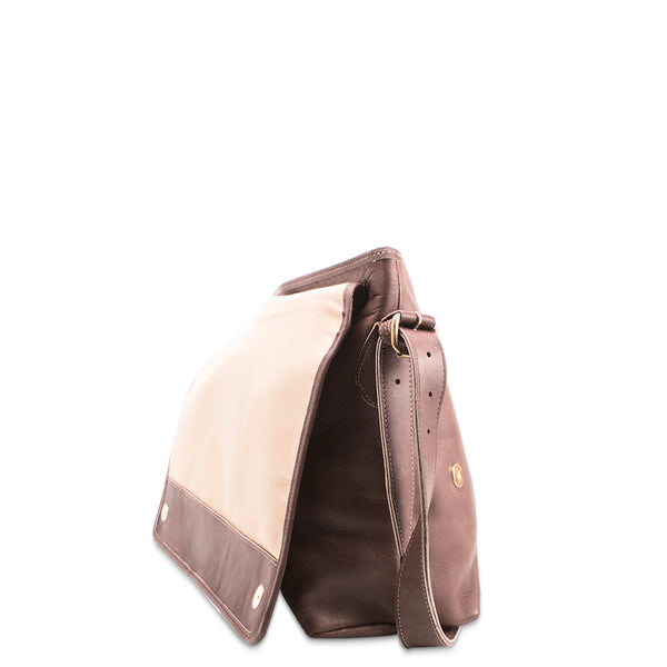 Brown leather handbag with beige interior on a white background