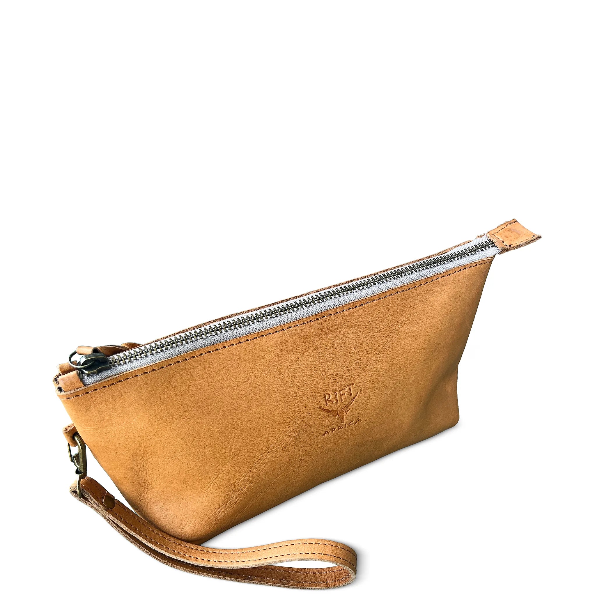 Brown leather toiletry bag with a strap on a white background