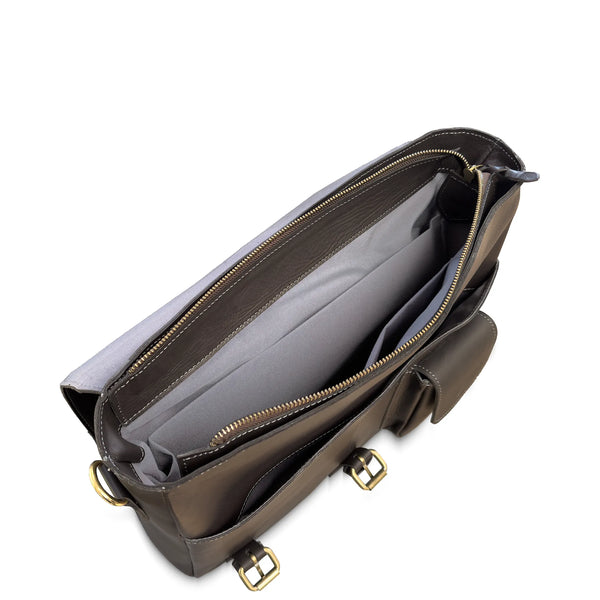 Brown leather bag with gold zipper and hardware on a white background