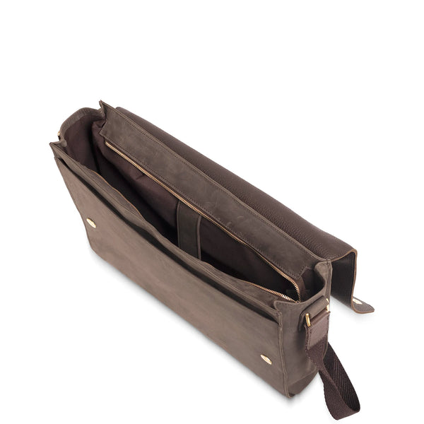 Brown leather bag with a strap on a white background