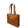 Brown leather tote bag on a white background