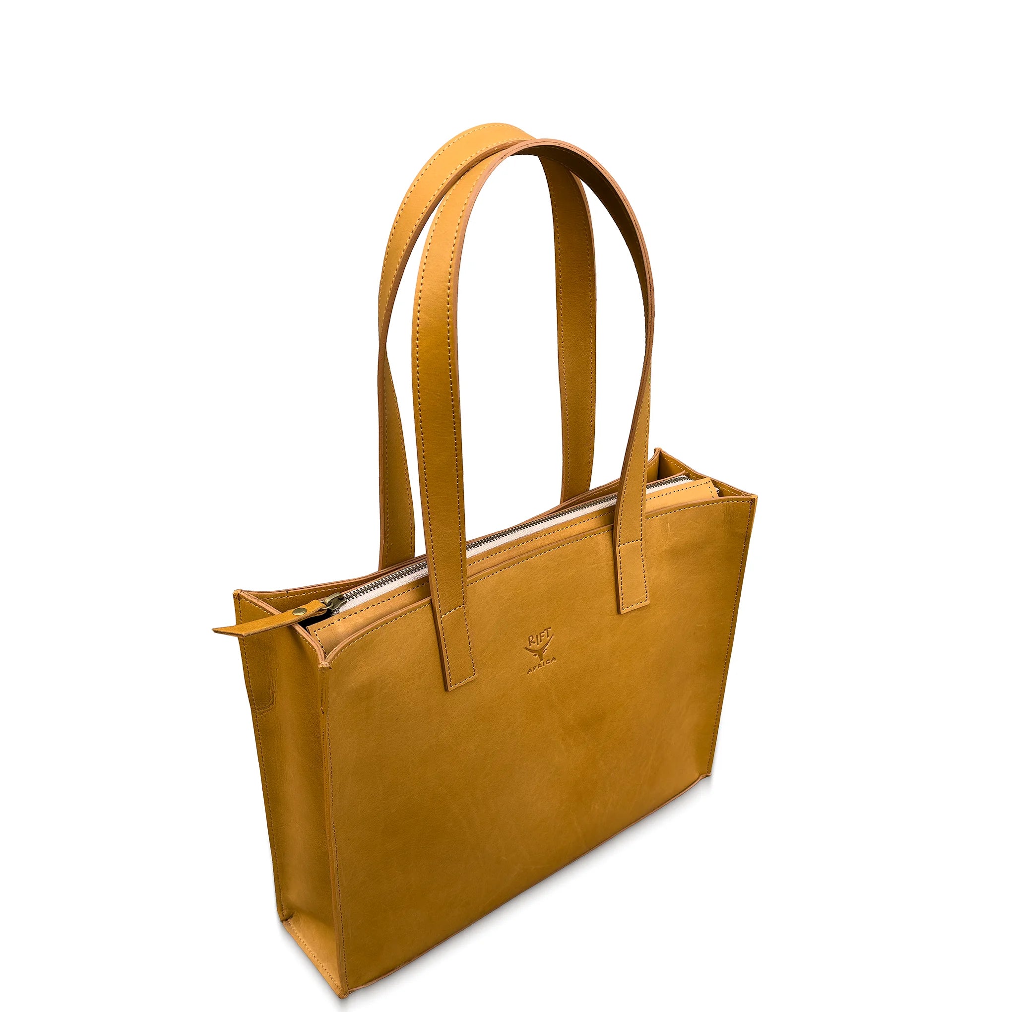 Tan leather tote bag with a zipper on a white background