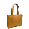 Tan leather tote bag on a white background