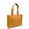 Tan leather tote bag on a white background