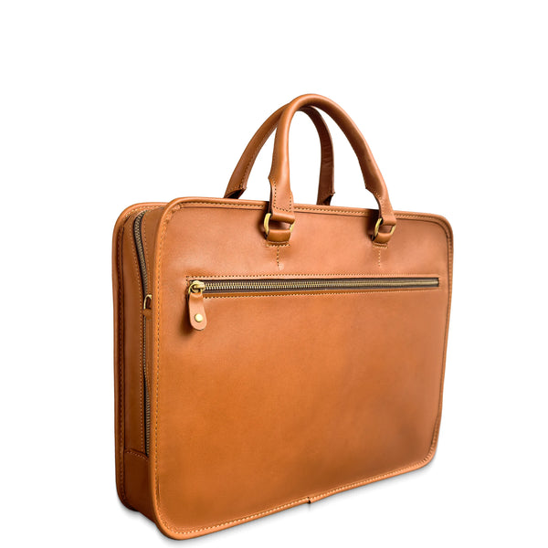 Brown leather briefcase with gold zipper pulls on a white background
