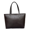 Black leather tote bag with a visible brand logo on a white background