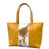 Tan tote bag with cowhide pattern on a white background