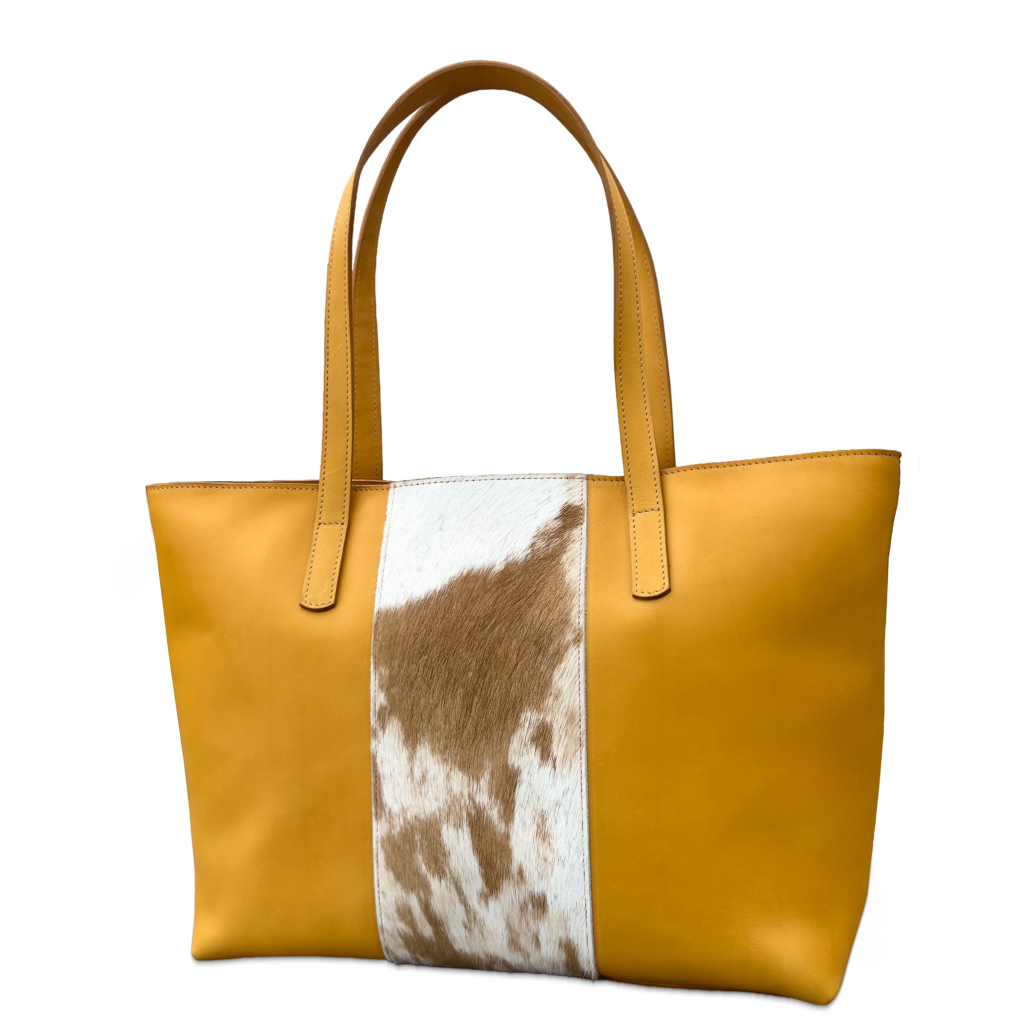 Tan tote bag with cowhide pattern on a white background