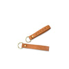 Brown leather keychain with gold hardware on a white background