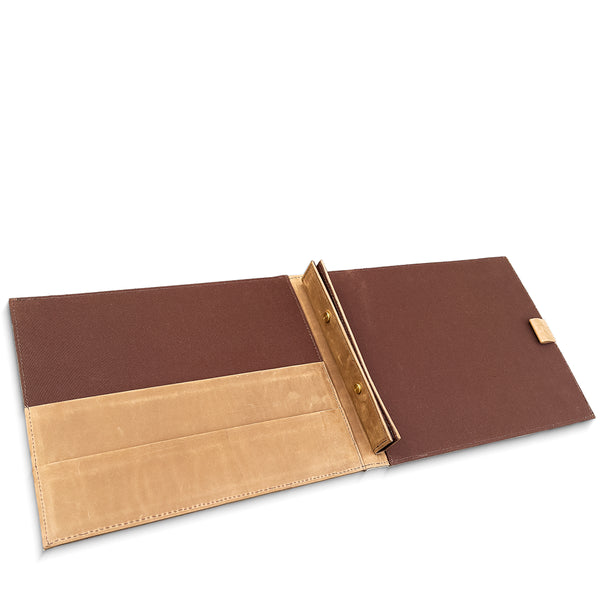 Brown leather room information holder with gold accents on a white background