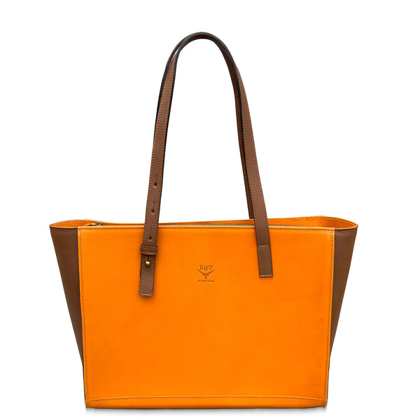 Orange leather tote bag with brown accents on a white background