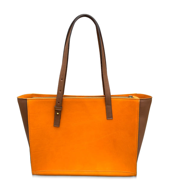 Orange leather tote bag with brown handles on a white background