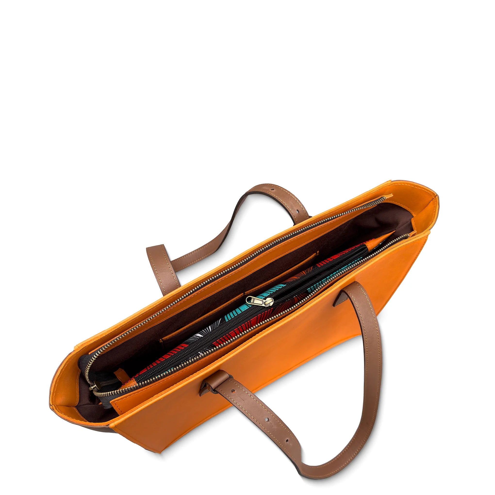 Orange leather tote bag with brown handles on a white background