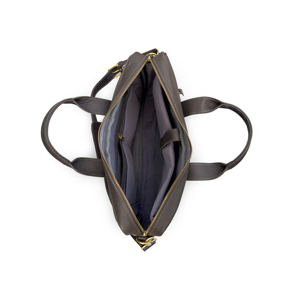 Brown leather handbag with gold zipper on a white background