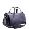 Blue leather duffel bag with gold zipper on a white background