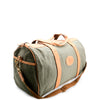 Green duffel bag with brown leather accents on a white background