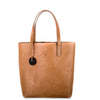 Brown leather tote bag with a visible brand logo on a white background