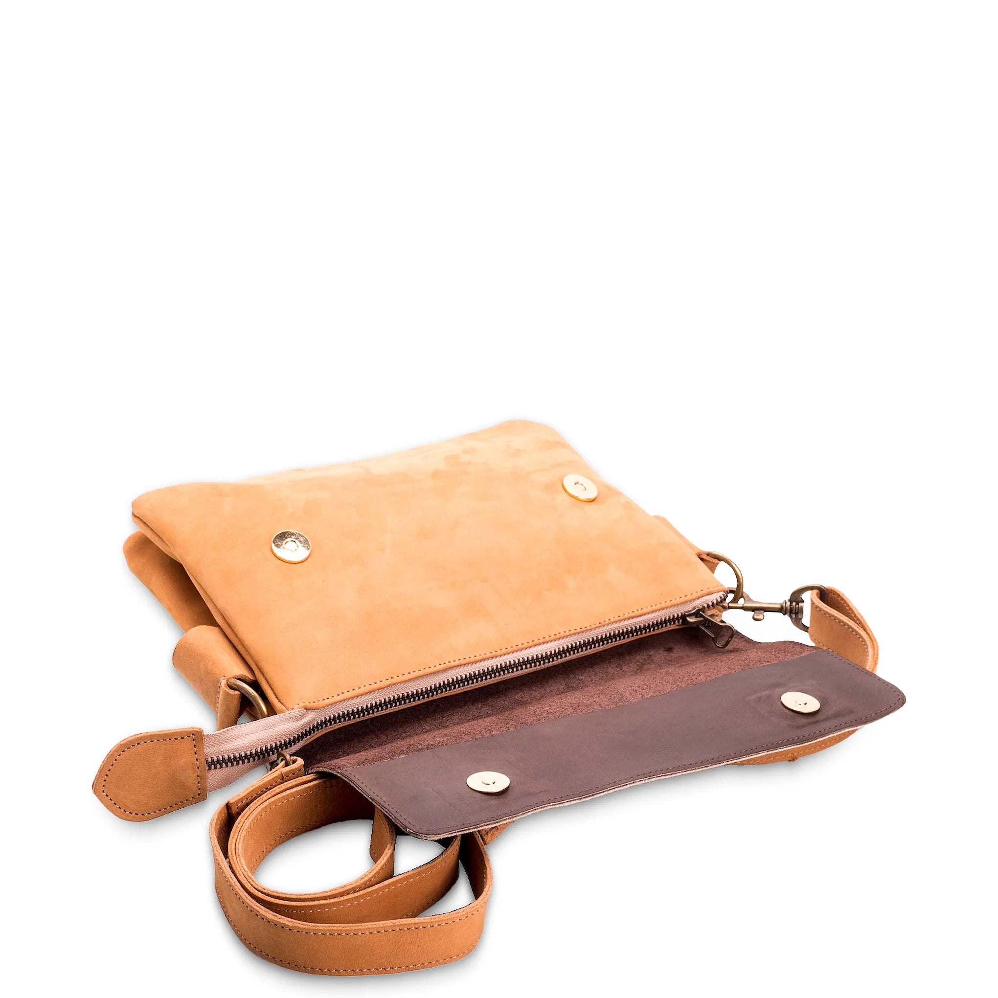 Tan leather crossbody bag with a strap on a white background