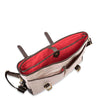 Beige shoulder bag with red interior on a white background