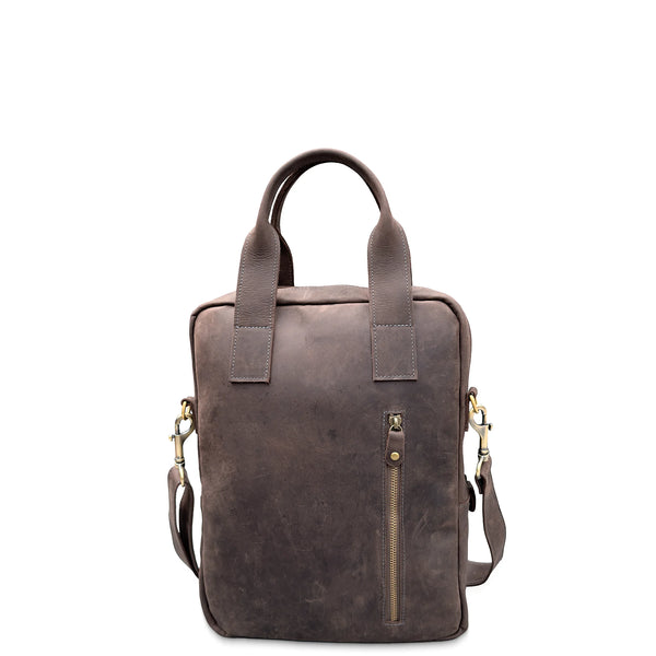 Brown leather backpack with gold zippers on a white background