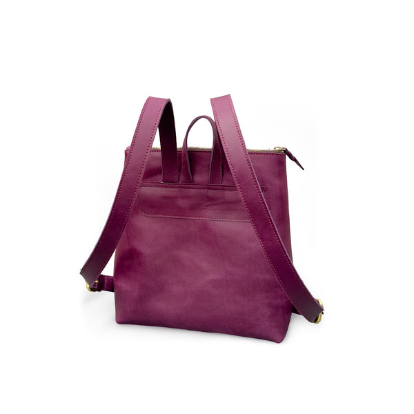 Purple Leather backpack with a shoulder strap on a white background