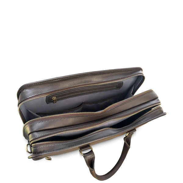 Brown leather briefcase with gold zipper on a white background