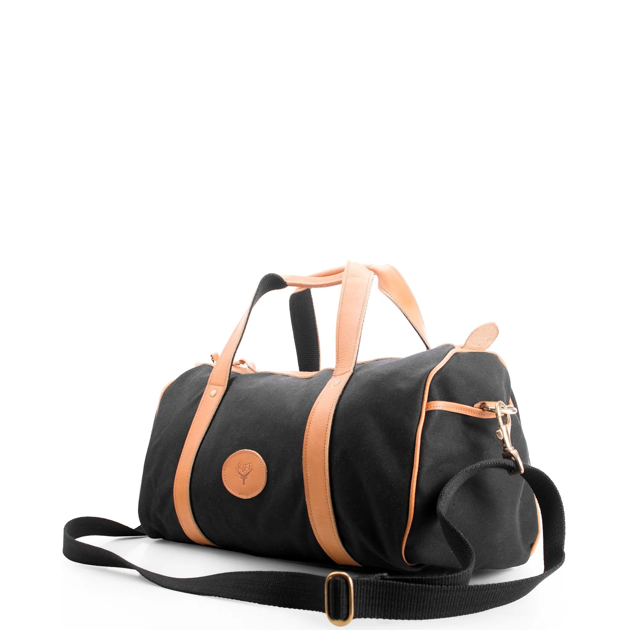 Black duffel bag with tan straps on a white background