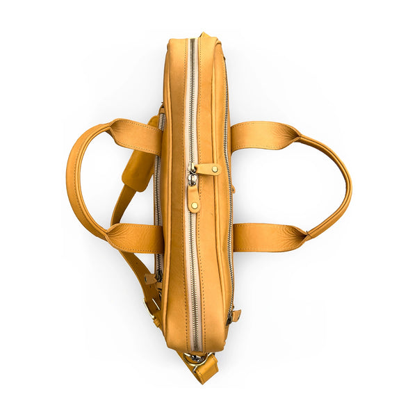 Tan leather briefcase  with straps on a white background