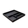 Black leather tray with compartments on a white background