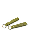 Green leather keychain with floral embossing on a white background