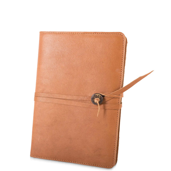 Brown leather notebook with a strap on a white background