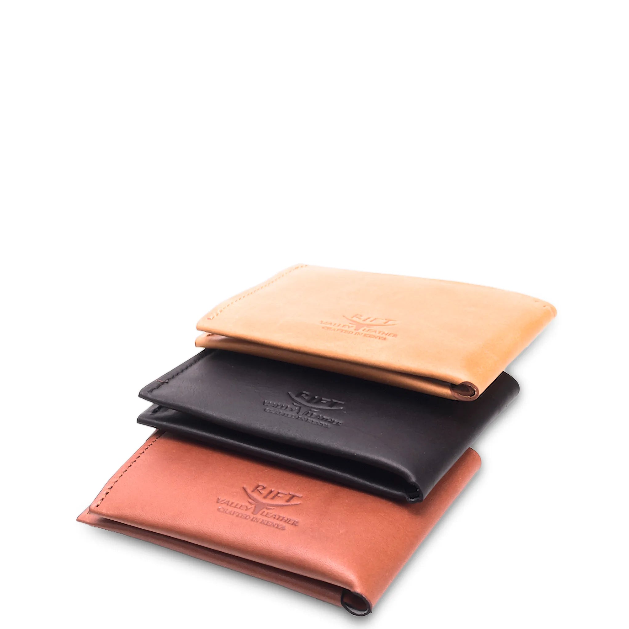 Three leather wallets in different colors stacked on a white background