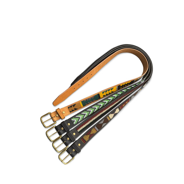 Set of leather belts with different patterns on a white background