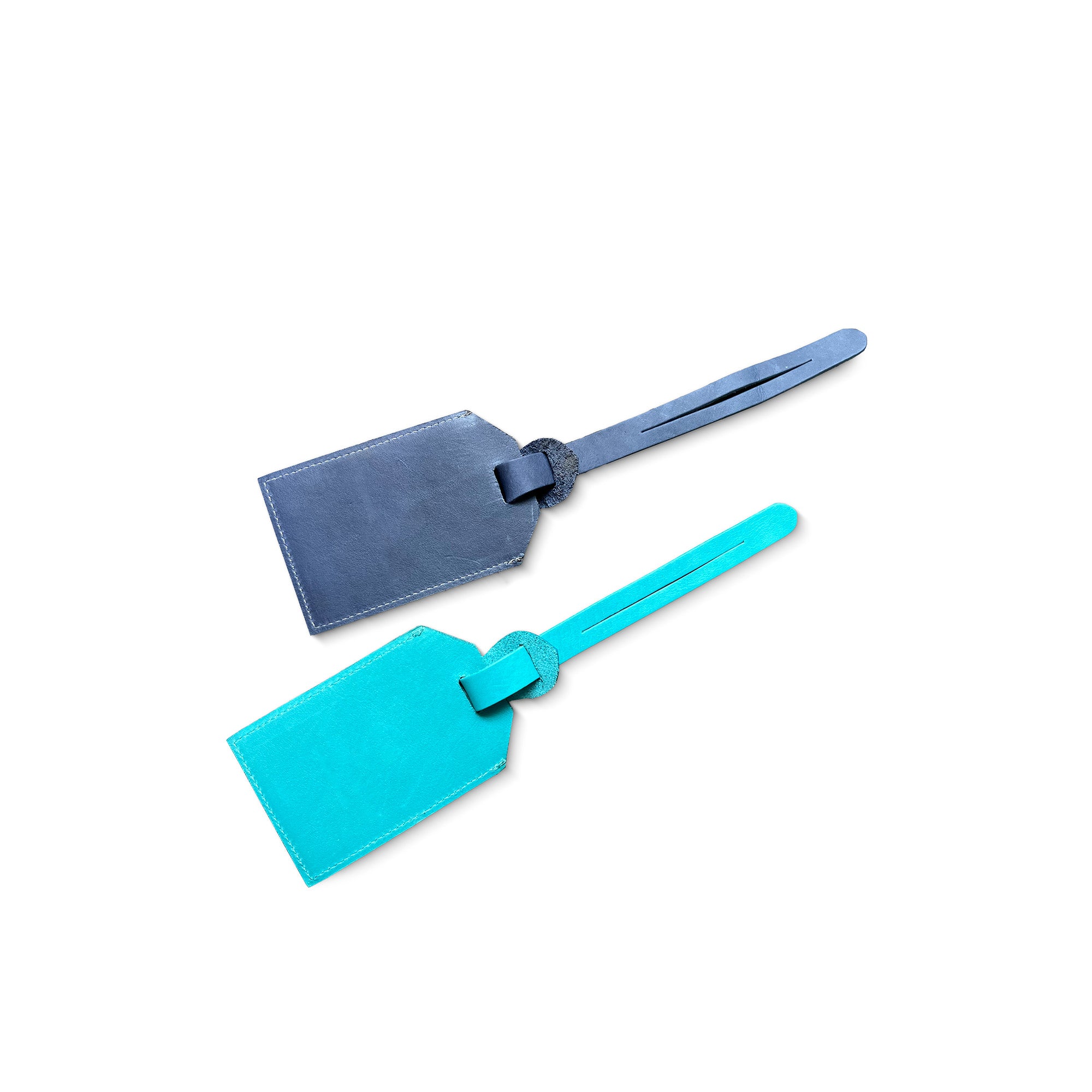 Two leather luggage tags, one blue and one turquoise, on a white background