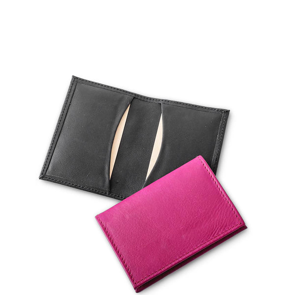 Black and pink leather card holders on a white background