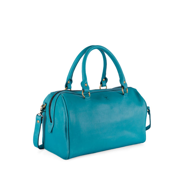 Turquoise leather handbag with gold accents on a white background