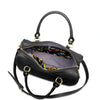 Black handbag with colorful interior lining on a white background