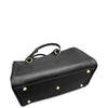 Black leather bag with gold studs on a white background