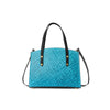 Blue textured leather handbag with black straps on a white background