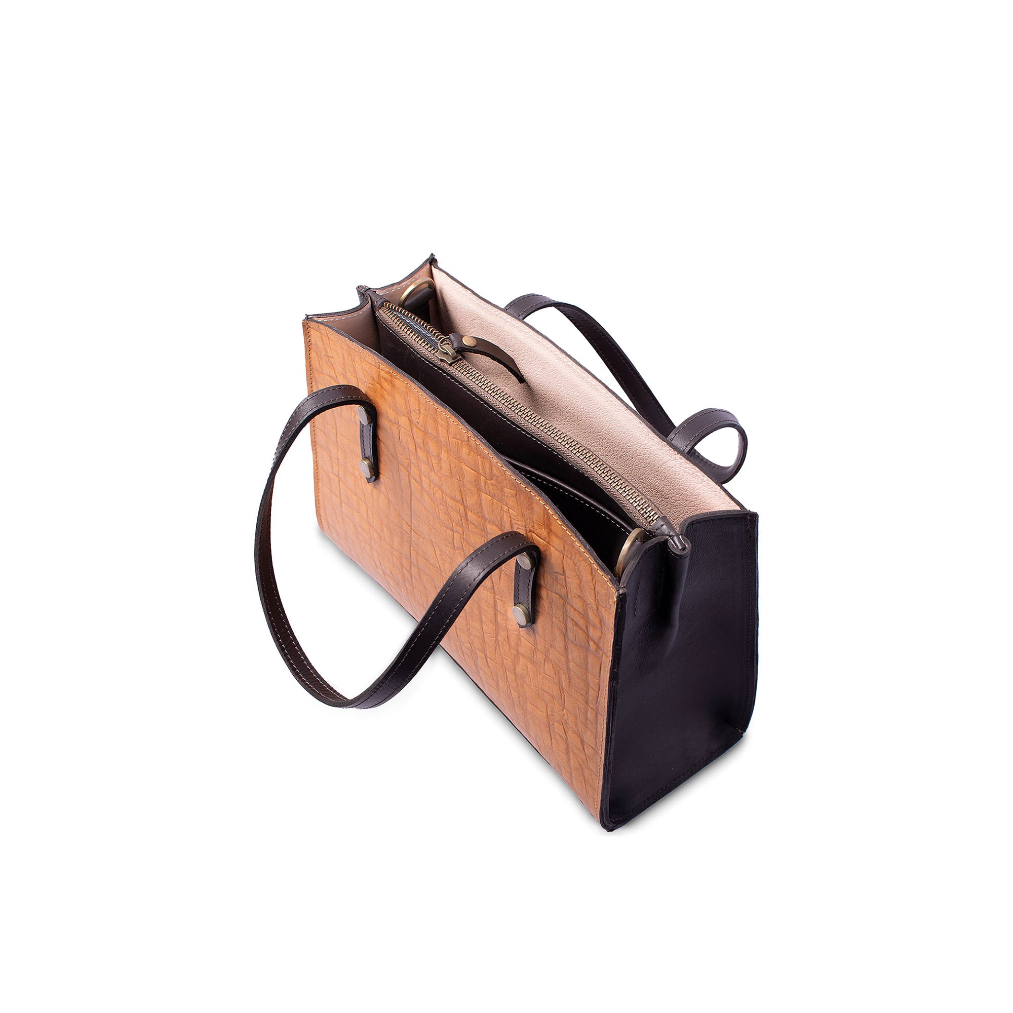 Brown leather handbag with black accents on a white background