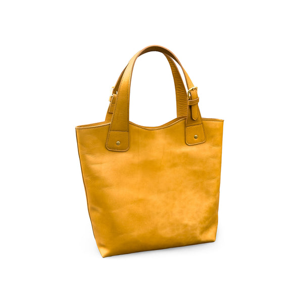 tan leather handbag on a white background