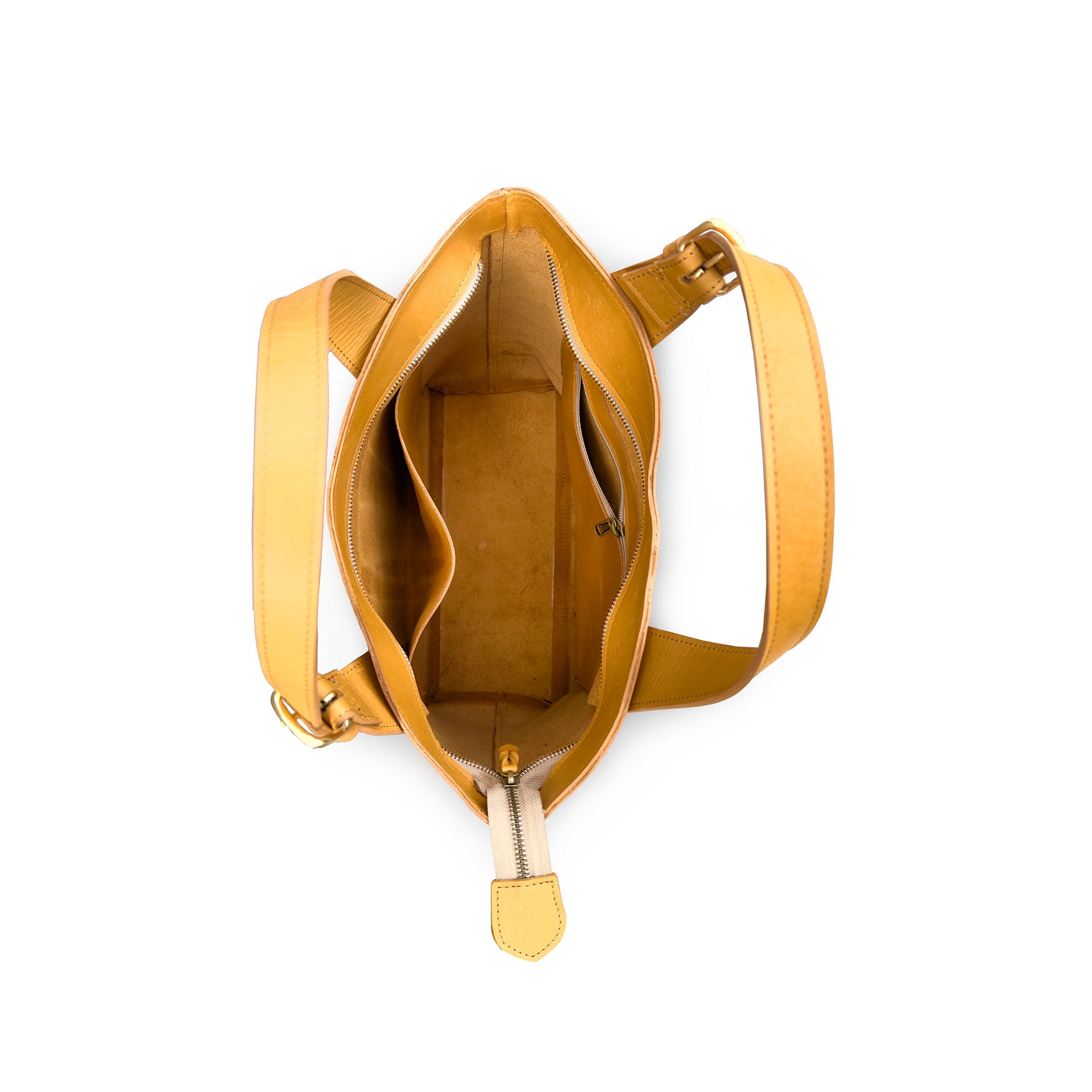 tan handbag with a shoulder strap on a white background