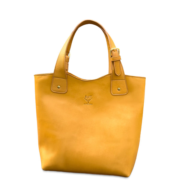 Yellow tote bag with a visible brand logo on a white background