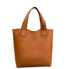 Brown leather tote bag with gold accents on a white background