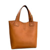 Brown leather tote bag with gold buckle on a white background