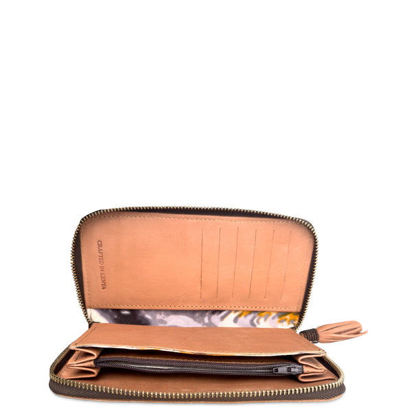 An open brown leather zip-around wallet with multiple card slots, a patterned interior lining, and a zippered compartment, shown on a plain white background.